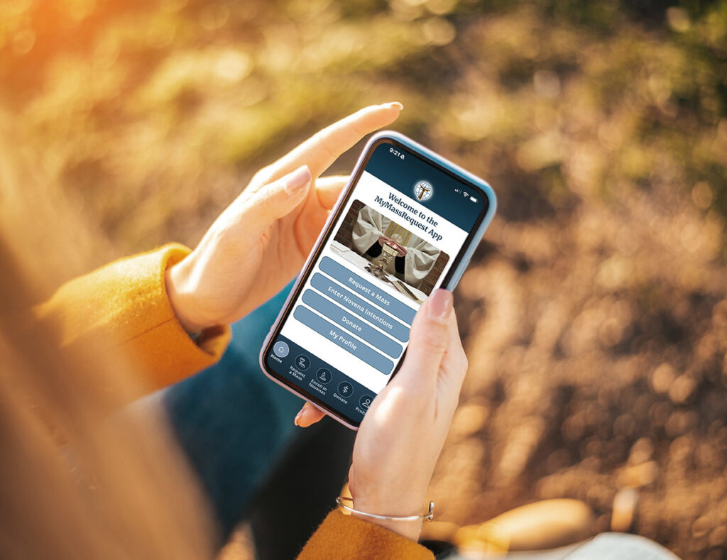 Person holding smartphone with MyMassRequest app open in a park setting
